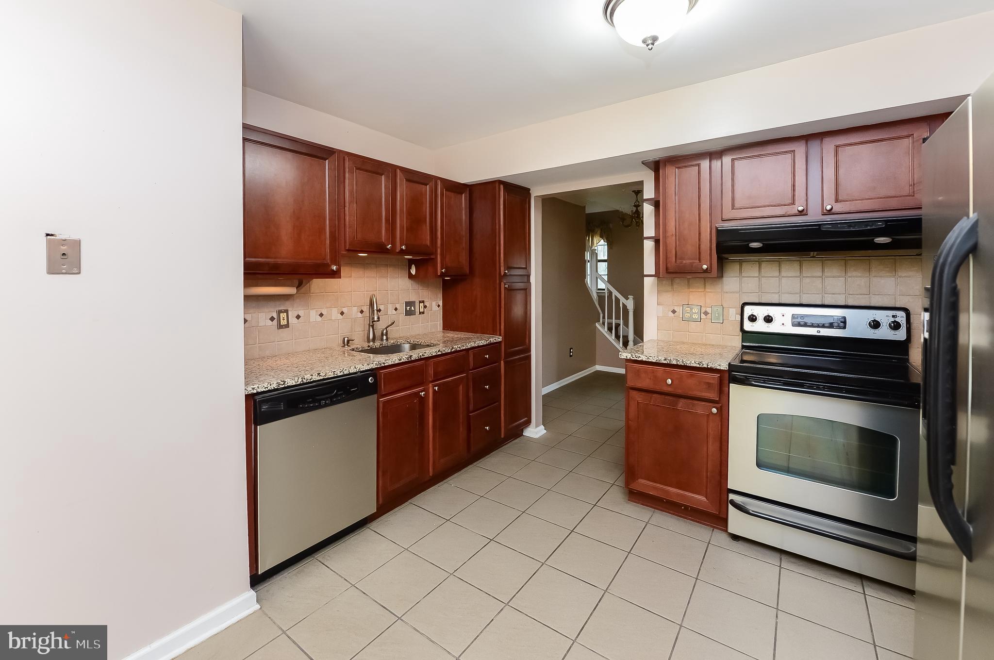 24 Dover Road Westampton, NJ 08060 - Photo 10 of 23 a kitchen with stainless steel appliances granite countertop a stove and a microwave