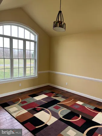 a room with a bed and a window