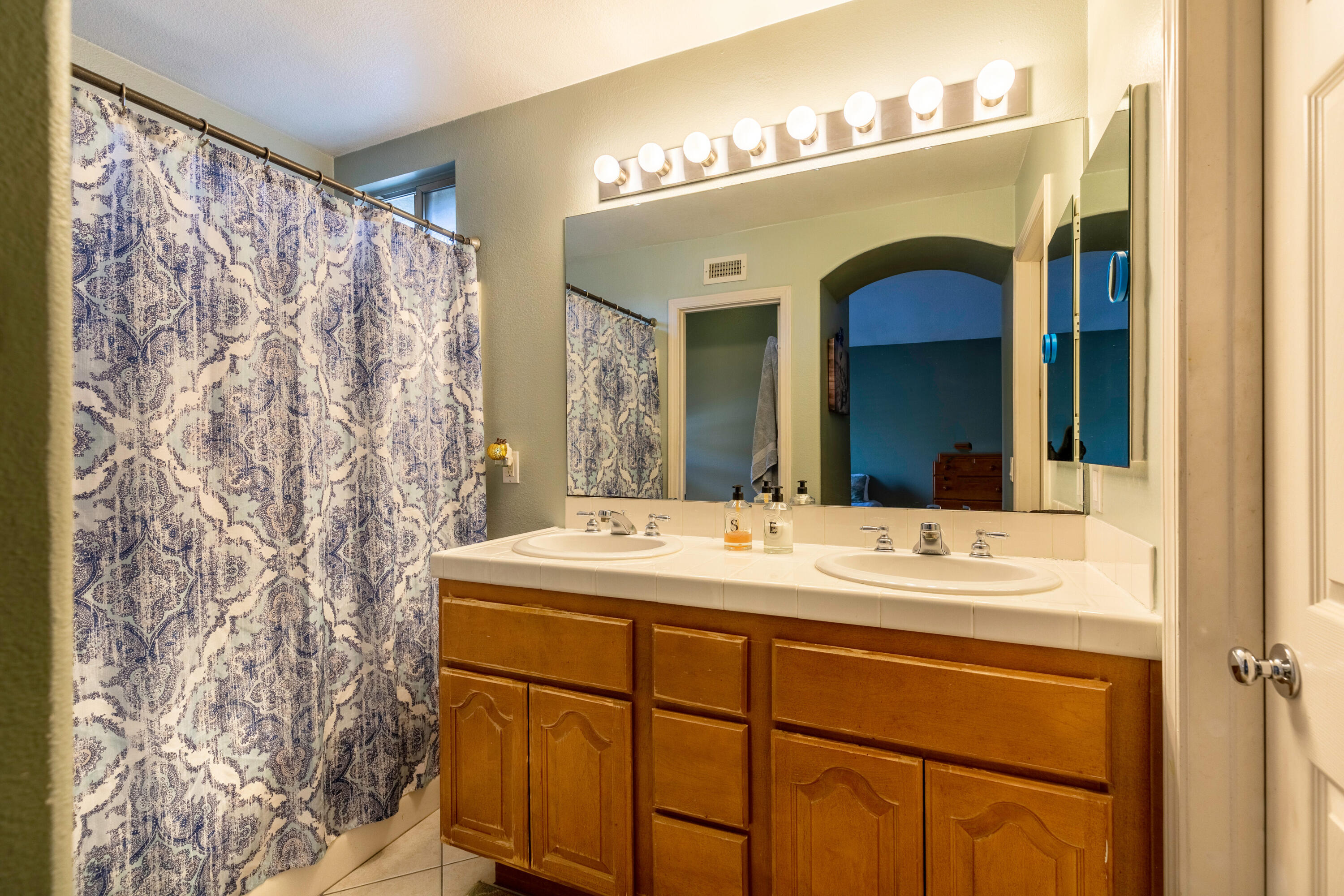 28341 Willow Court Saugus, CA 91350 - Photo 15 of 23 a bathroom with a sink and a mirror