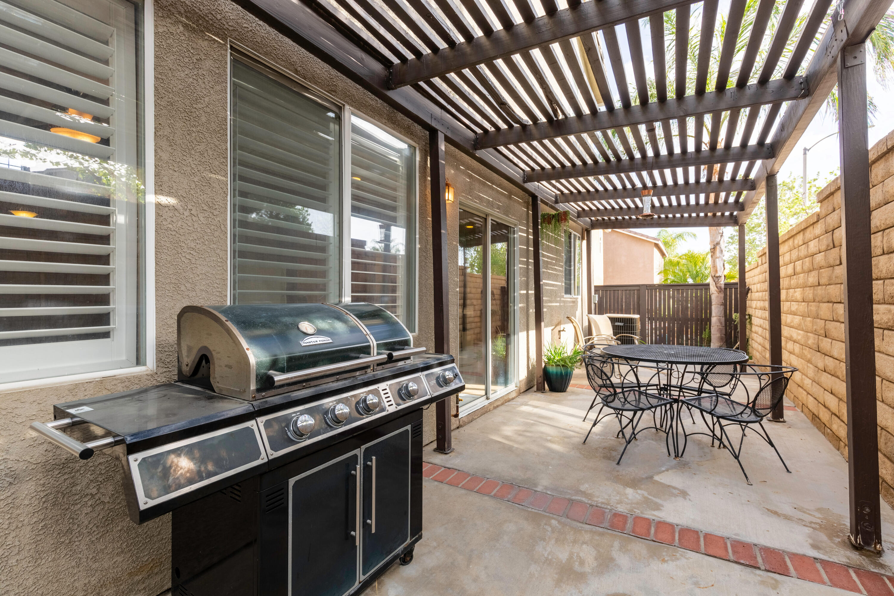 28341 Willow Court Saugus, CA 91350 - Photo 21 of 23 a view of a dining room with furniture wooden floor and a chandelier
