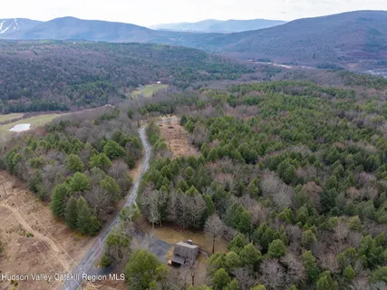 a view of outdoor space with deck area and trees