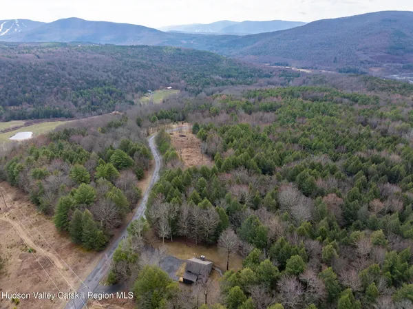 a view of outdoor space with deck area and trees