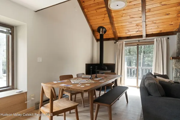 a view of a livingroom with furniture and a window