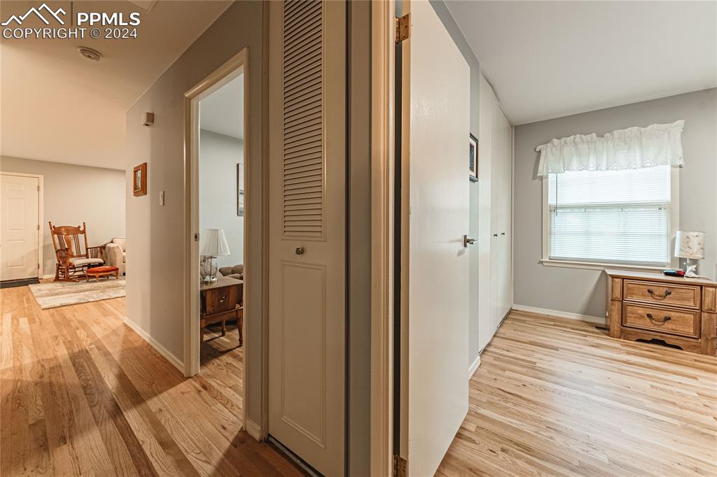 1407 Alexander Road Colorado Springs, CO 80909 - Photo 18 of 27 a view of a room with wooden floor and furniture