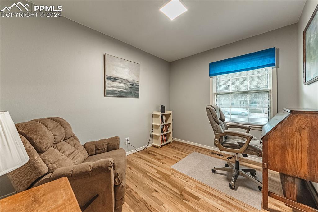 1407 Alexander Road Colorado Springs, CO 80909 - Photo 19 of 27 a workspace with furniture and a window