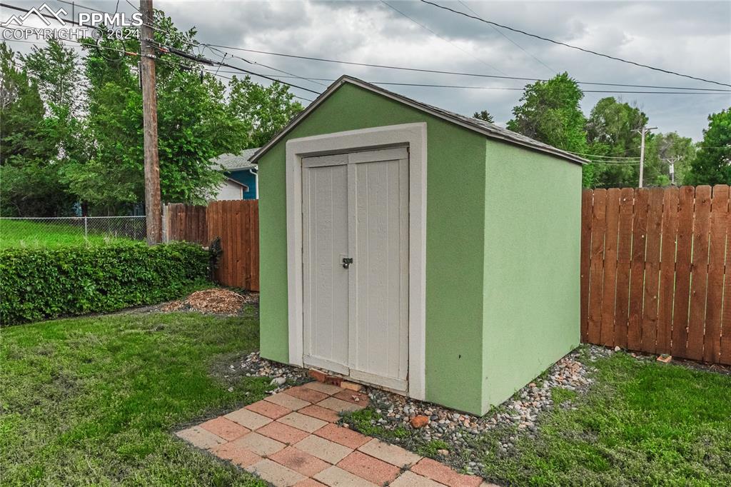 1407 Alexander Road Colorado Springs, CO 80909 - Photo 25 of 27 a house view with a backyard space