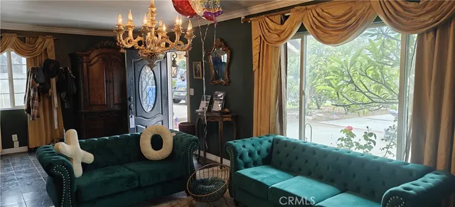 a dining room with furniture and window or chandelier