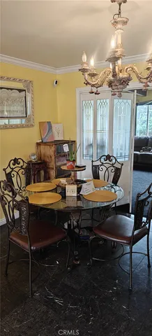 a dining room with furniture and window or chandelier