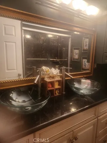 a bathroom with a sink and mirror