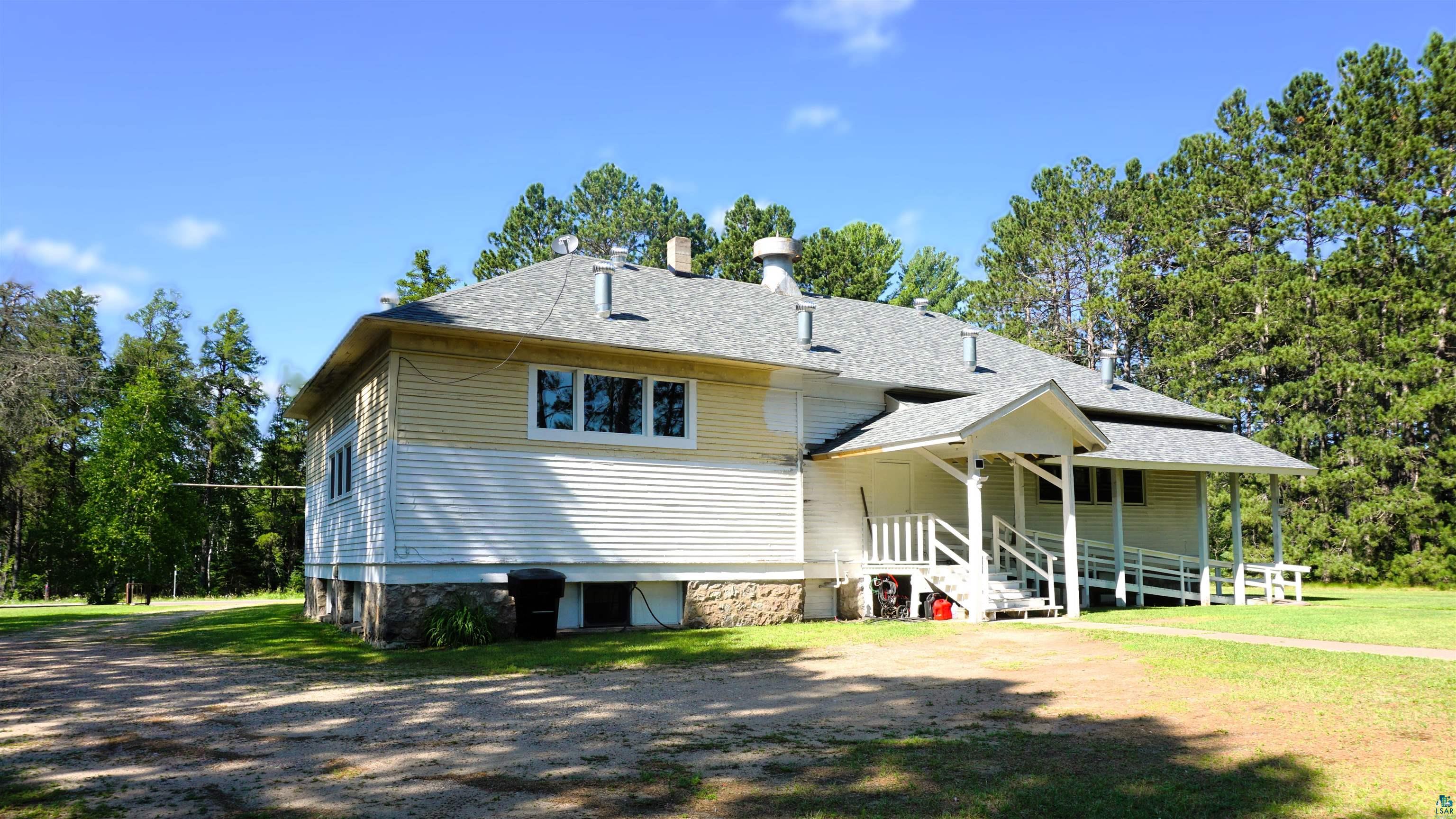 7596 Werner Road Virginia, MN 55792 - Photo 24 of 27 Exterior featuring horizontal siding, a covered porch with white railings, and a ramp entry