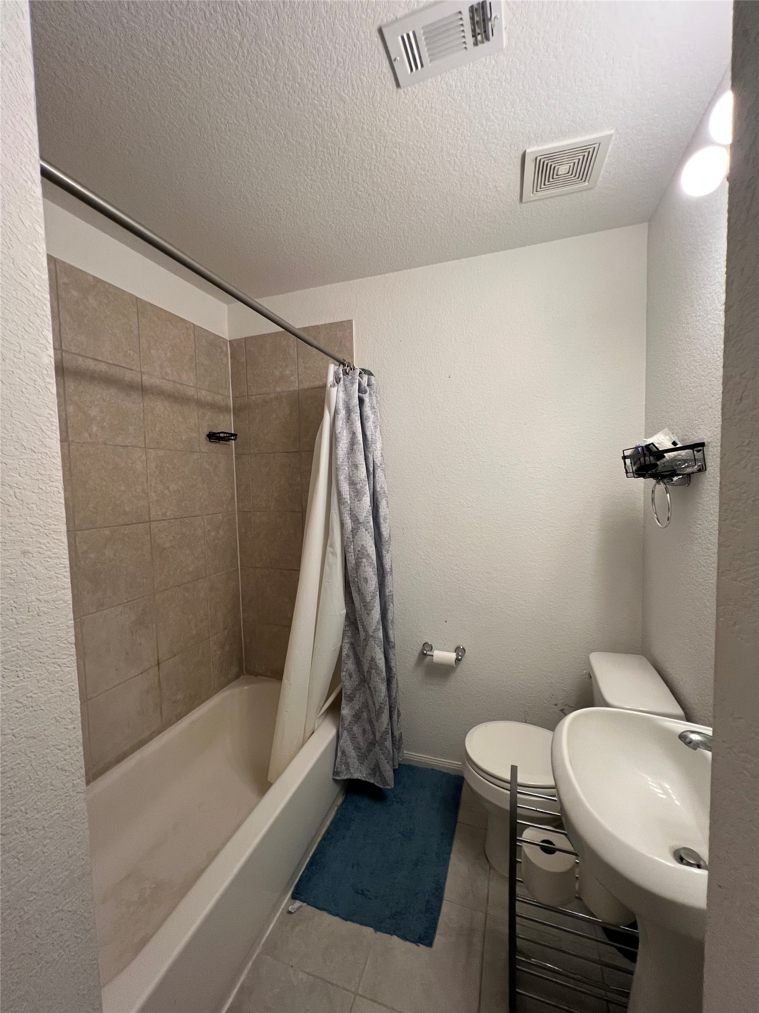 4139 Sam Houston Road Willis, TX 77378 - Photo 21 of 26 Second full bath next to Bedroom 2 has tub/shower combo.