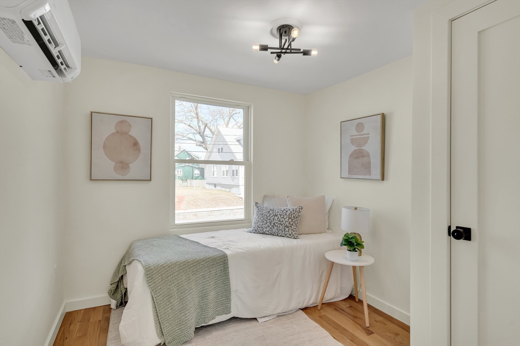 56 Riverview Street Dedham, MA 02026 - Photo 20 of 29 a bedroom with a bed and a window