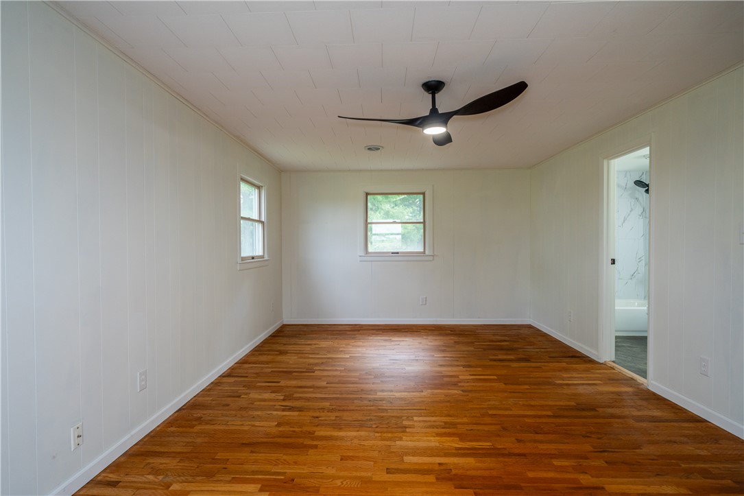 11296 Pansing Road Brookville, OH 45309 - Photo 20 of 53 This spacious room features rich hardwood flooring and abundant natural light through multiple windows.