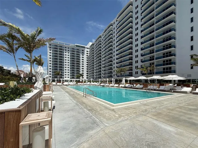 a view of swimming pool from a balcony