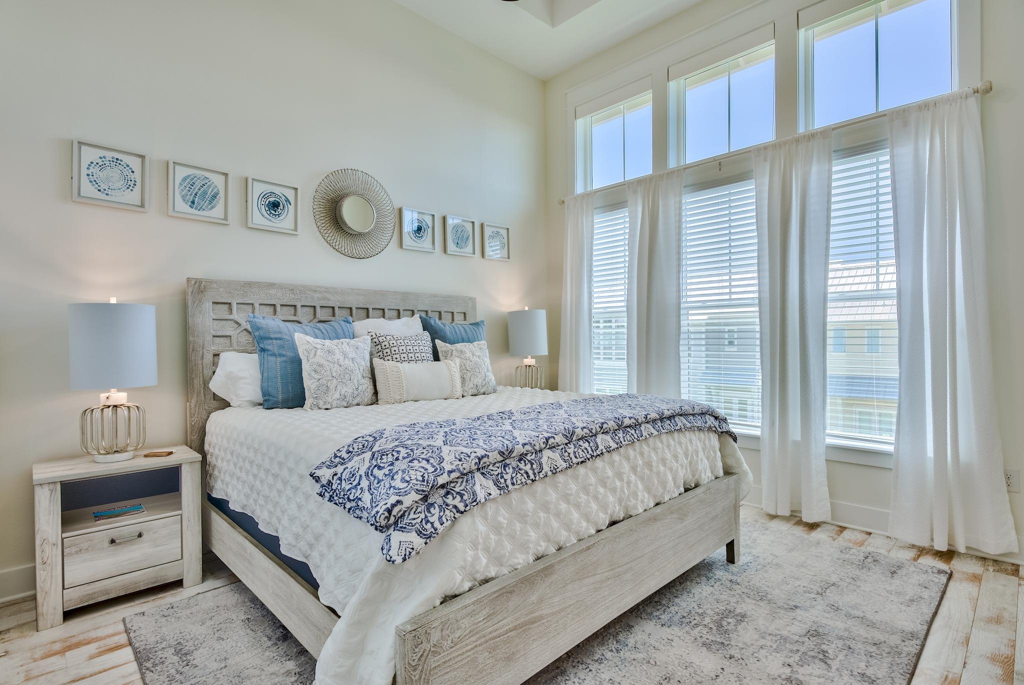 308 Milestone Dr Inlet Beach, Unit B Inlet Beach, FL 32461 - Photo 11 of 49 a bed room with a bed and a night stand