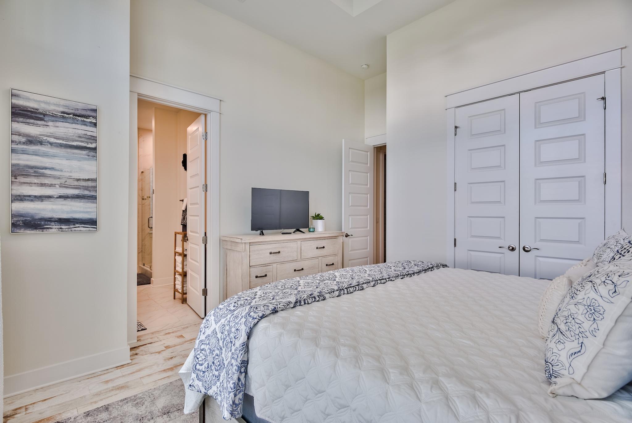 308 Milestone Dr Inlet Beach, Unit B Inlet Beach, FL 32461 - Photo 13 of 49 a bedroom with a bed and a television