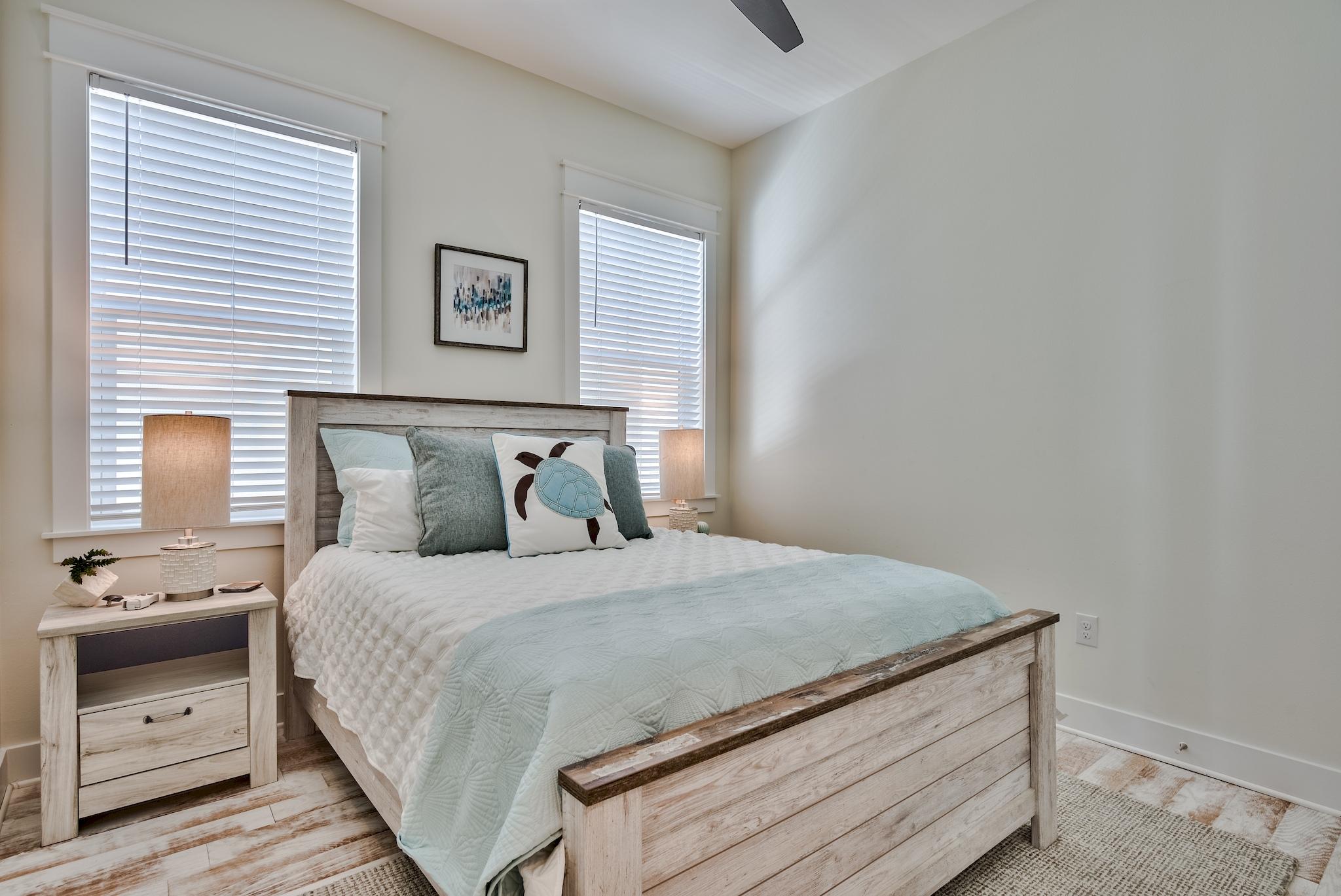 308 Milestone Dr Inlet Beach, Unit B Inlet Beach, FL 32461 - Photo 15 of 49 a bedroom with a bed and a window