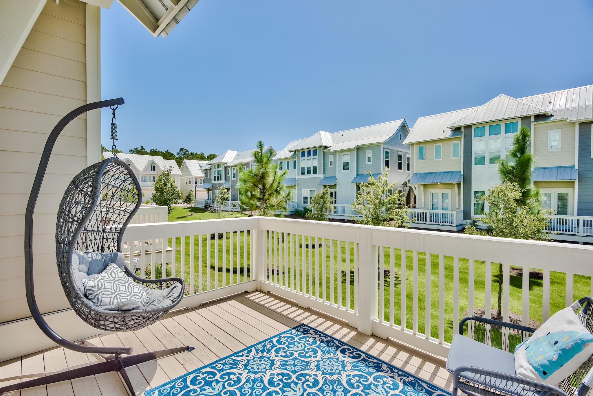 308 Milestone Dr Inlet Beach, Unit B Inlet Beach, FL 32461 - Photo 21 of 49 a view of a balcony with wooden floor