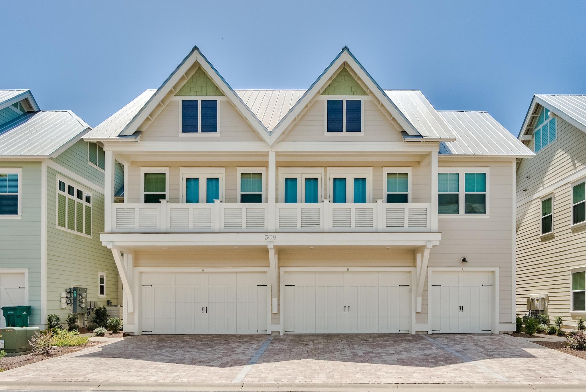 308 Milestone Dr Inlet Beach, Unit B Inlet Beach, FL 32461 - Photo 25 of 49 a view of a white house with large windows