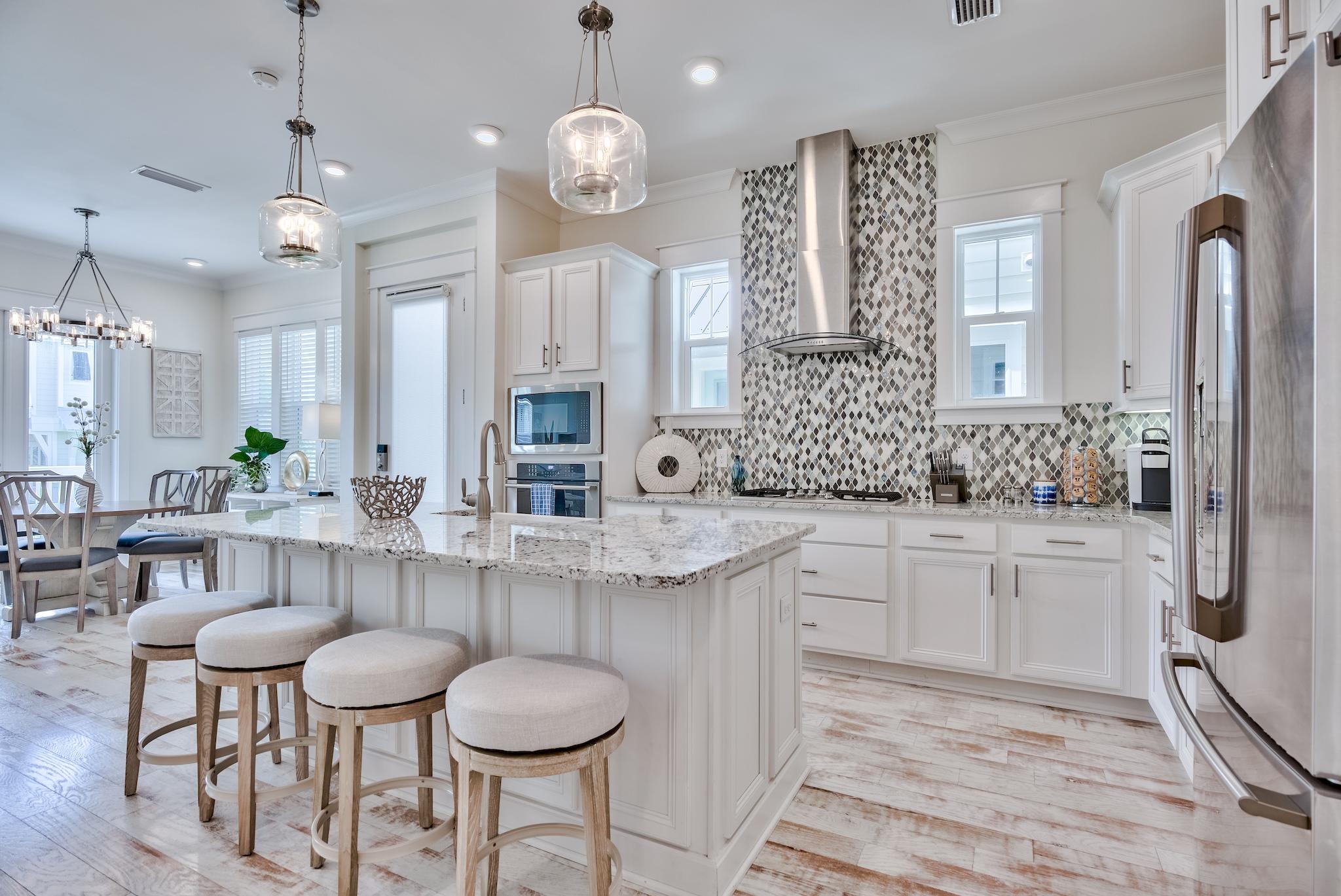 308 Milestone Dr Inlet Beach, Unit B Inlet Beach, FL 32461 - Photo 10 of 49 a large kitchen with a table and chairs
