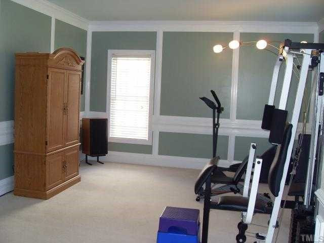 116 Beckford Road Cary, NC 27518 - Photo 4 of 12 Living Room can be used for any HomeOwners Needs from Exercise to Study/Office or Display your Grand Piano Here! Library
