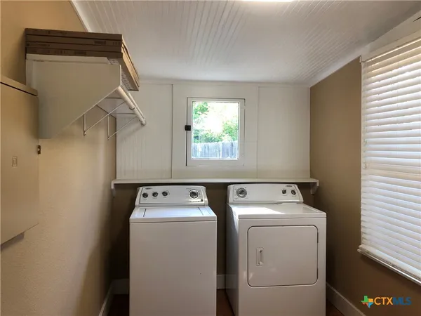 a house with swimming pool in front of it