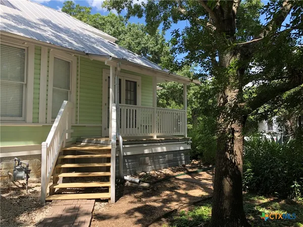 a view of a back yard of the house