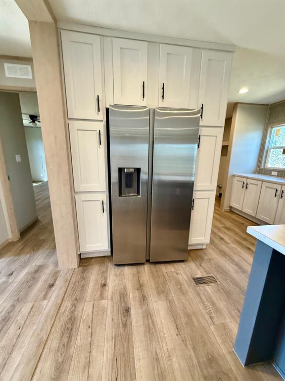 136 County Road 1736 Chico, TX 76431 - Photo 15 of 27 a kitchen with granite countertop a refrigerator and a sink