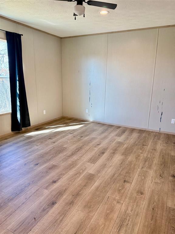 136 County Road 1736 Chico, TX 76431 - Photo 16 of 27 a view of an empty room with wooden floor