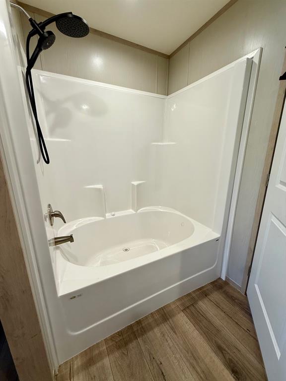 136 County Road 1736 Chico, TX 76431 - Photo 18 of 27 a bathroom with a bathtub and shower
