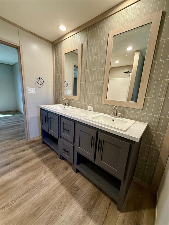 136 County Road 1736 Chico, TX 76431 - Photo 19 of 27 a spacious bathroom with a double vanity sink and a mirror
