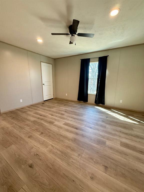 136 County Road 1736 Chico, TX 76431 - Photo 20 of 27 a view of an empty room with window and wooden floor
