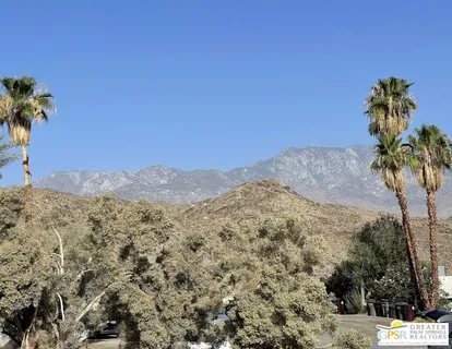 a view of a living room with furniture