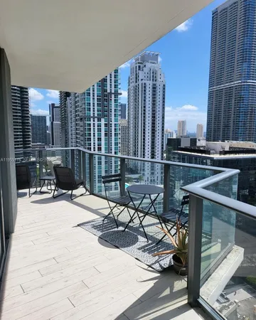 a view of a patio with a table and chairs