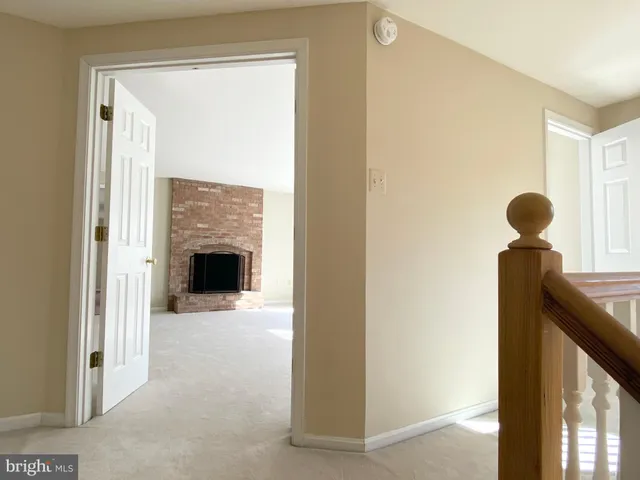 a view of livingroom with window fireplace and windows