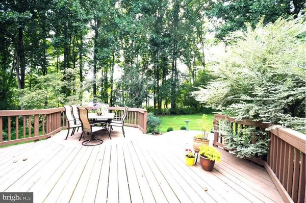 a view of a table and chairs on the roof deck