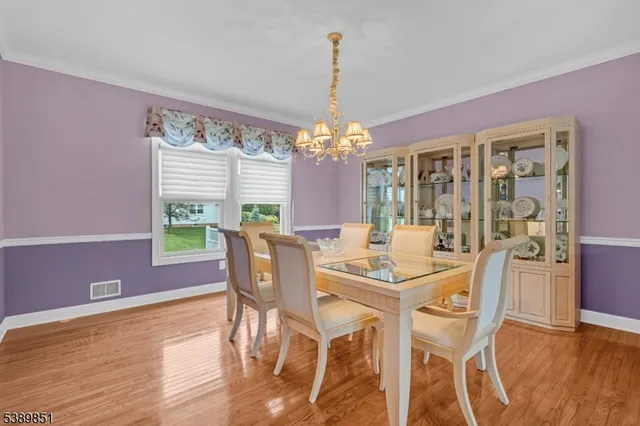 a view of a dining room with furniture and window