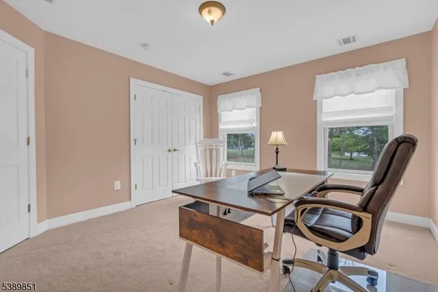 a workspace with furniture and window