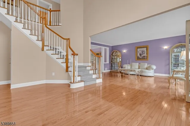 a view of livingroom with dining room and wooden floor
