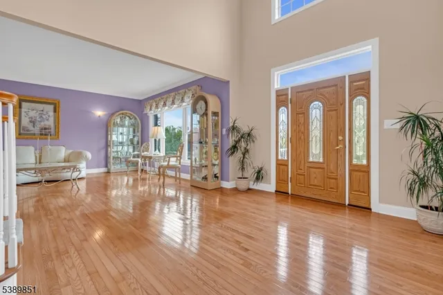 a view of a living room and hardwood floor