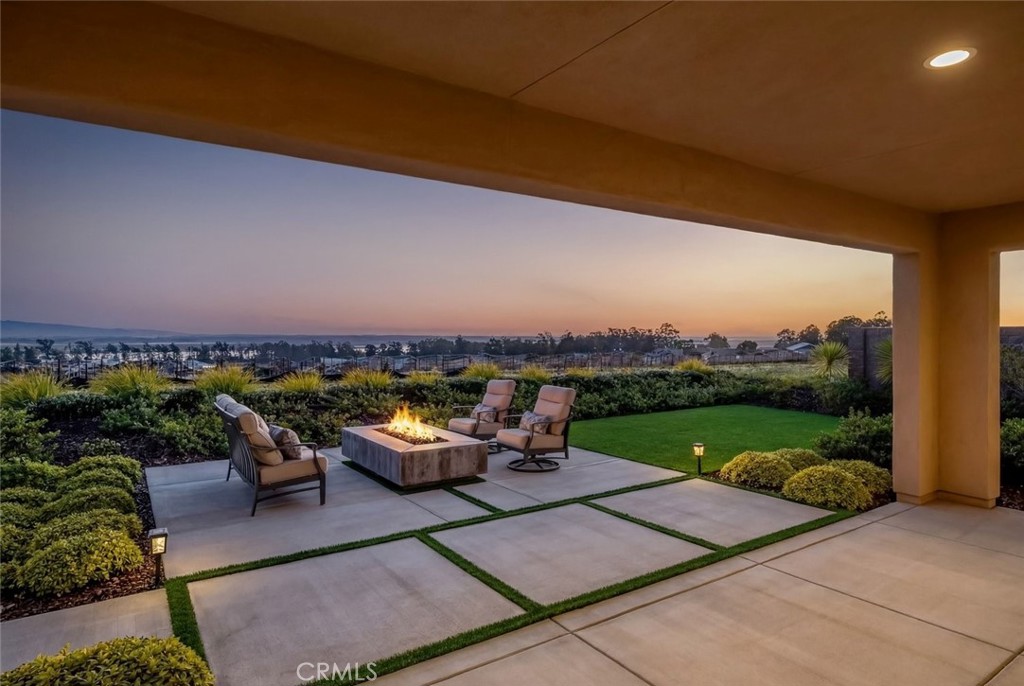 1658 Eucalyptus Road Nipomo, CA 93444 - Photo 2 of 75 a view of a patio with lawn chairs plants and lake view