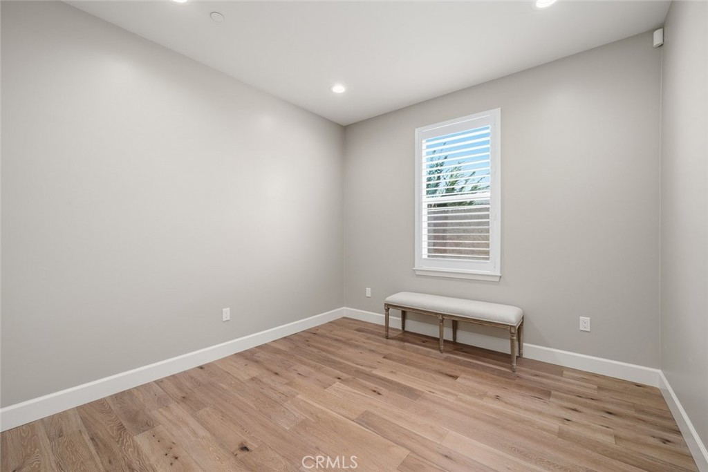 1658 Eucalyptus Road Nipomo, CA 93444 - Photo 38 of 75 a view of an empty room with wooden floor and a window