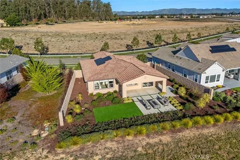 a view of a patio with a table and chairs