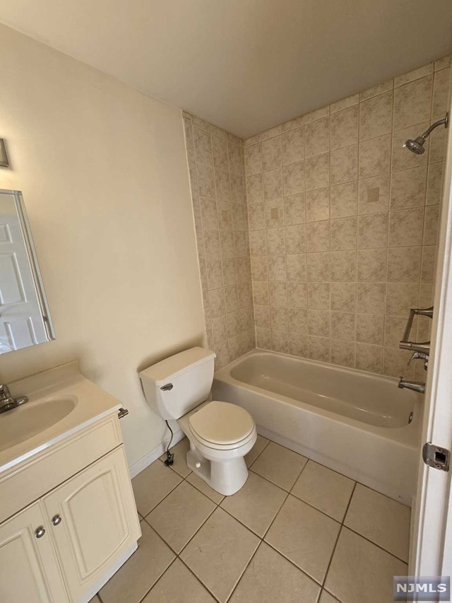 a bath room with a toilet and a bath tub