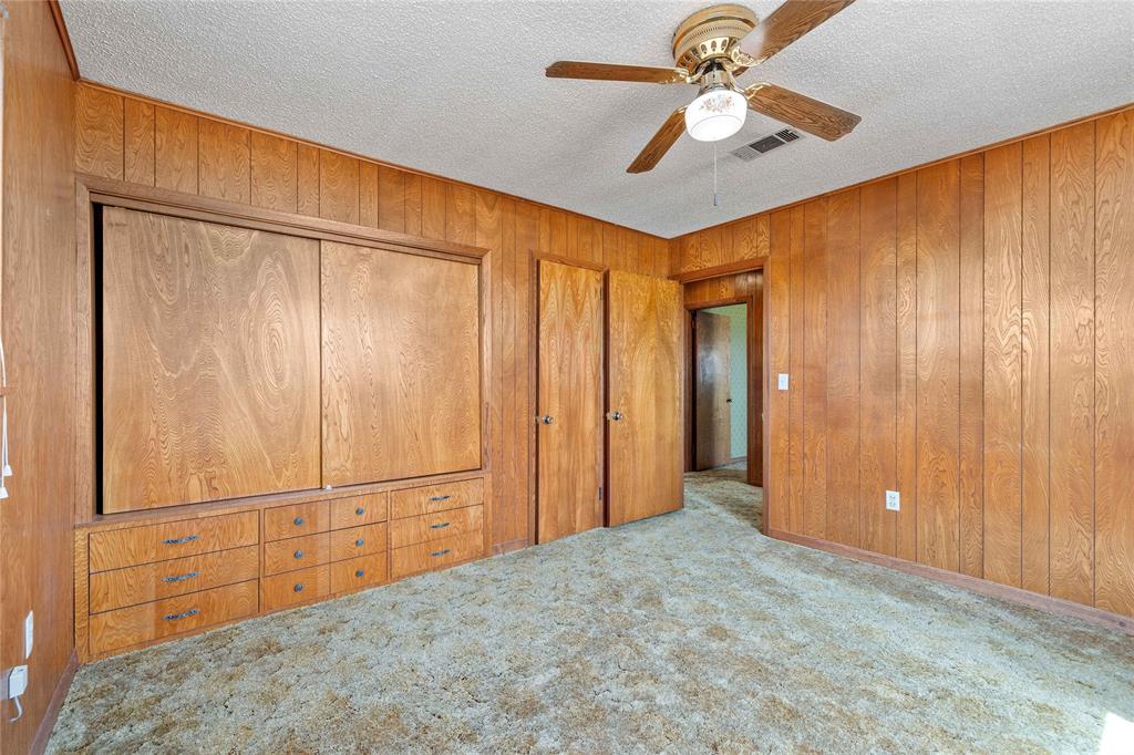 53 County Road 312 Goldthwaite, TX 76844 - Photo 27 of 35 an empty room with closet and chandelier fan