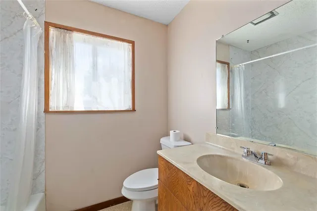 a view of a garage with furniture and storage