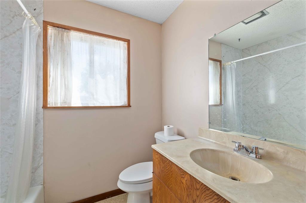 53 County Road 312 Goldthwaite, TX 76844 - Photo 28 of 35 a bathroom with a toilet sink and mirror