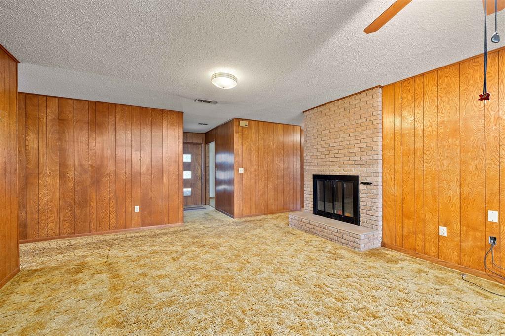 53 County Road 312 Goldthwaite, TX 76844 - Photo 8 of 35 a view of an empty room with a fireplace and a window