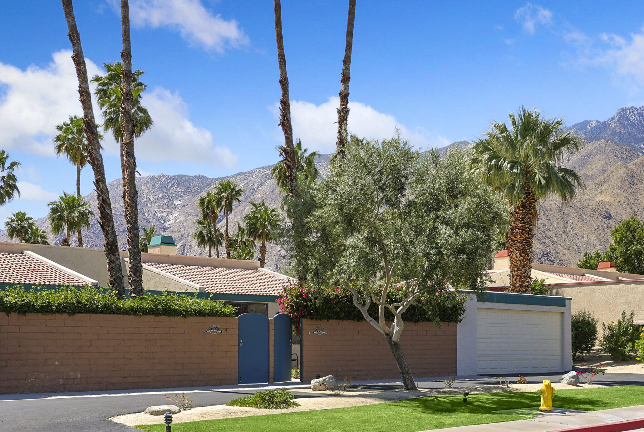 377 West Dominguez Road Palm Springs, CA 92262 - Photo 1 of 29 a front view of a house with yard and garage