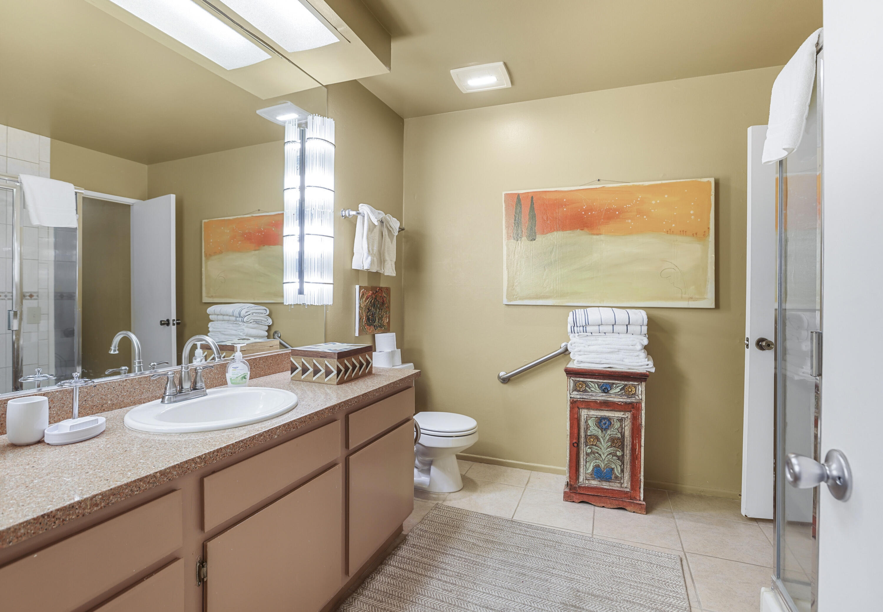 377 West Dominguez Road Palm Springs, CA 92262 - Photo 21 of 29 a bathroom with a toilet sink and mirror